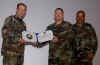MSgt Becker, accepting an Award of Excellence for the RAF Mildenhall Professional Development Center